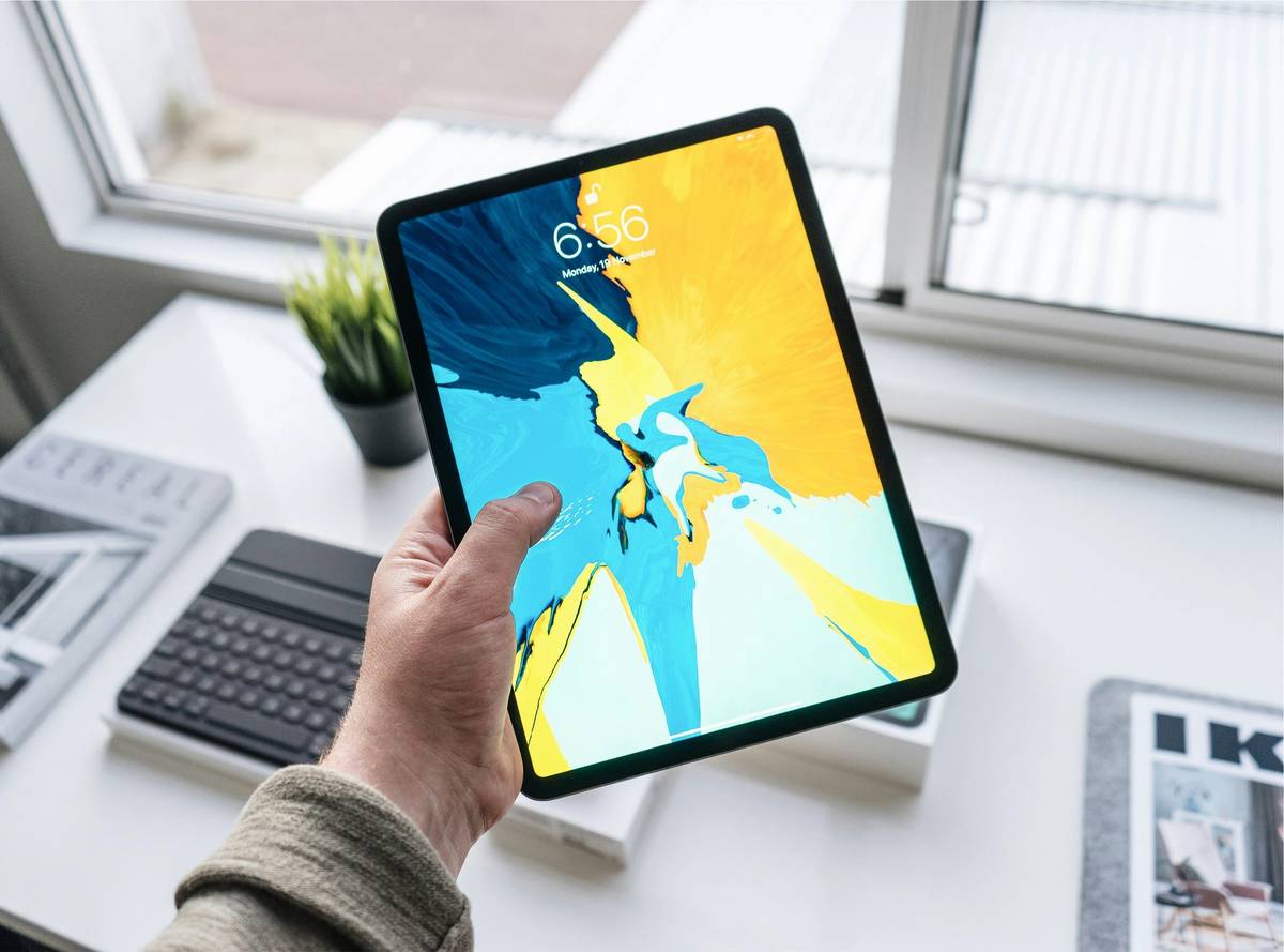 Gamer using tablet with external joystick showing full tablet joystick support